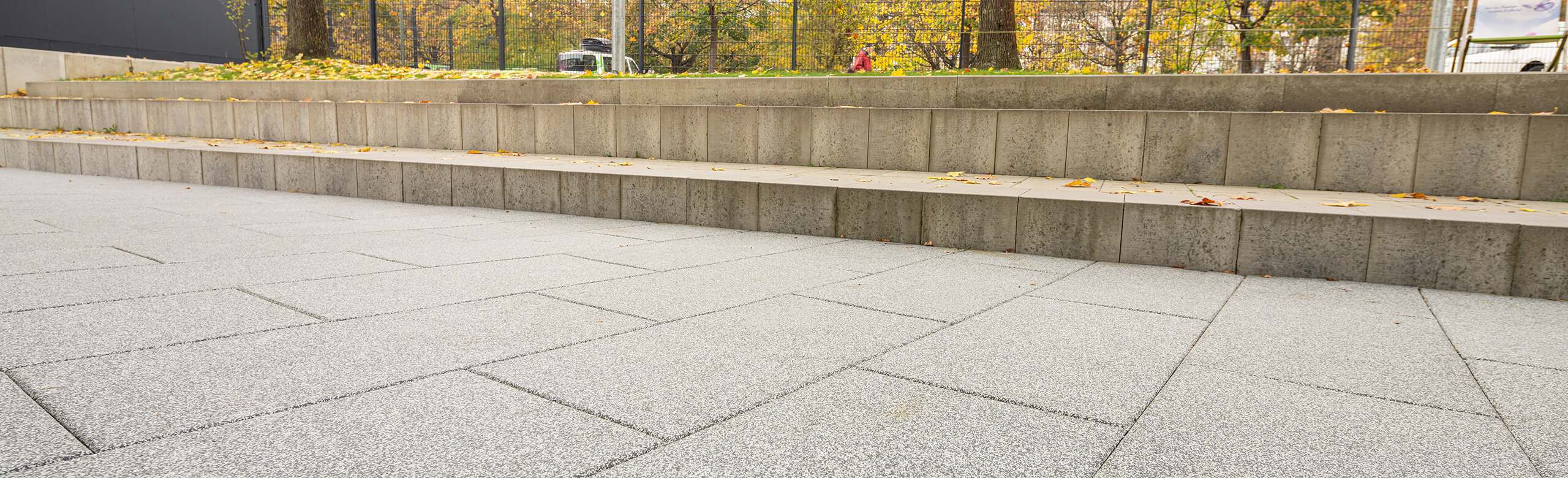 Modern safety flooring tiles on a playground in grey