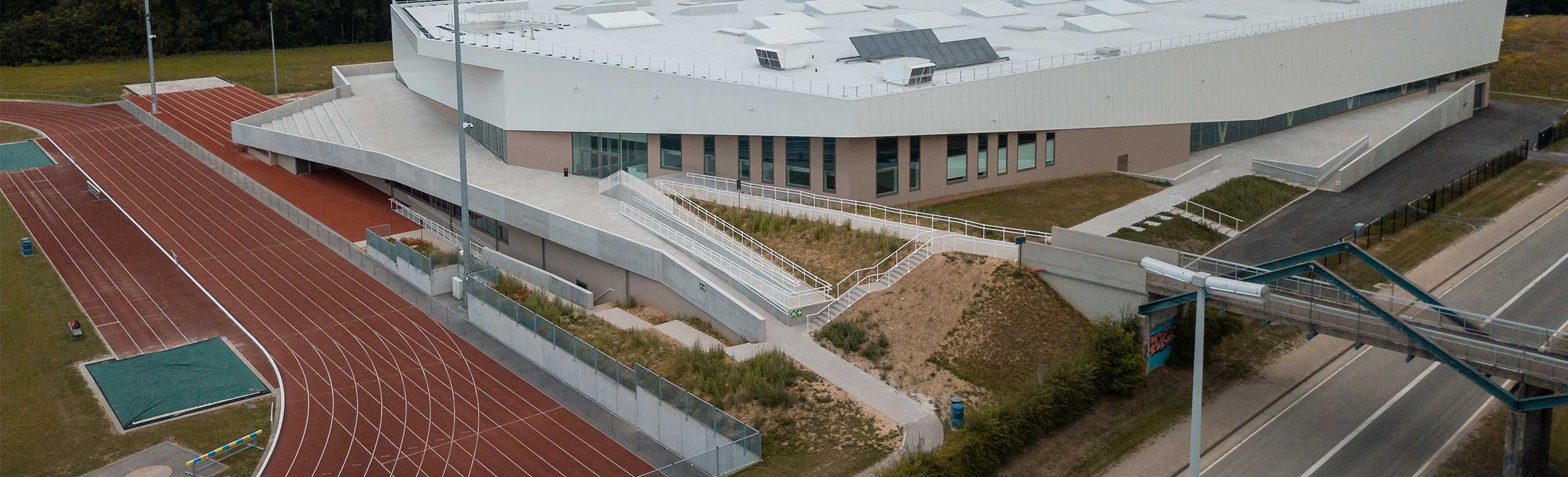 Athletics hall with sprint track in Louvain-la-Neuve, exterior view